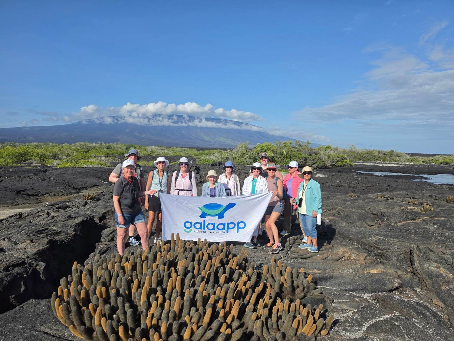Galápagos Island Hopping group with the Galaapp flag