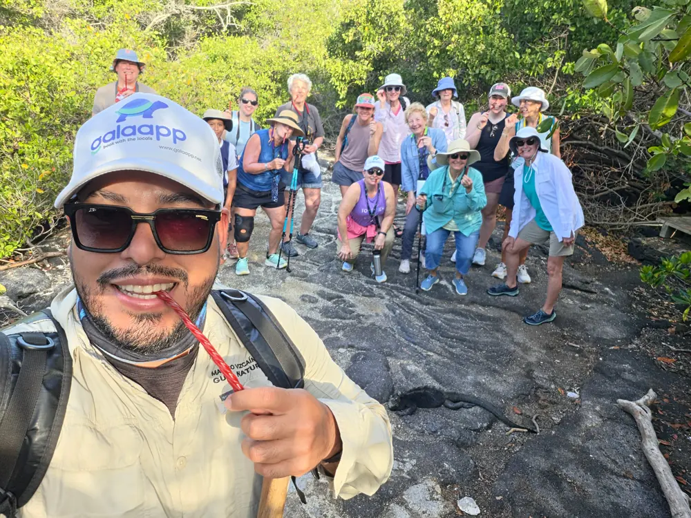 Marco Vizcaíno, naturalist guide at Galaapp, with a group of travelers on a walk in the Galapagos